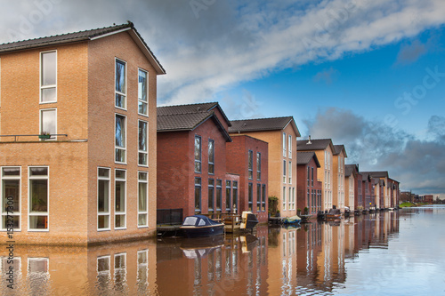 Modern Houses built in the Water in a row