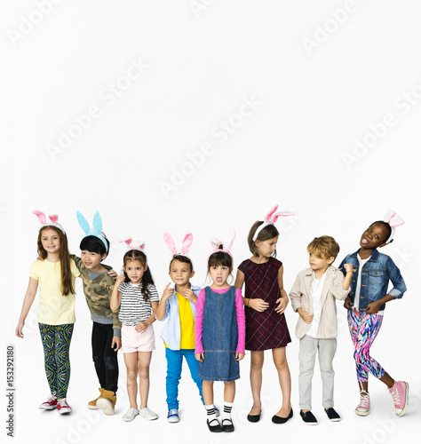 Group of Kids Wearing Bunny Ears for Easter Happiness Smiling on White Blackground