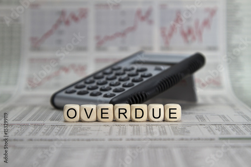 overdue word built with letter cubes