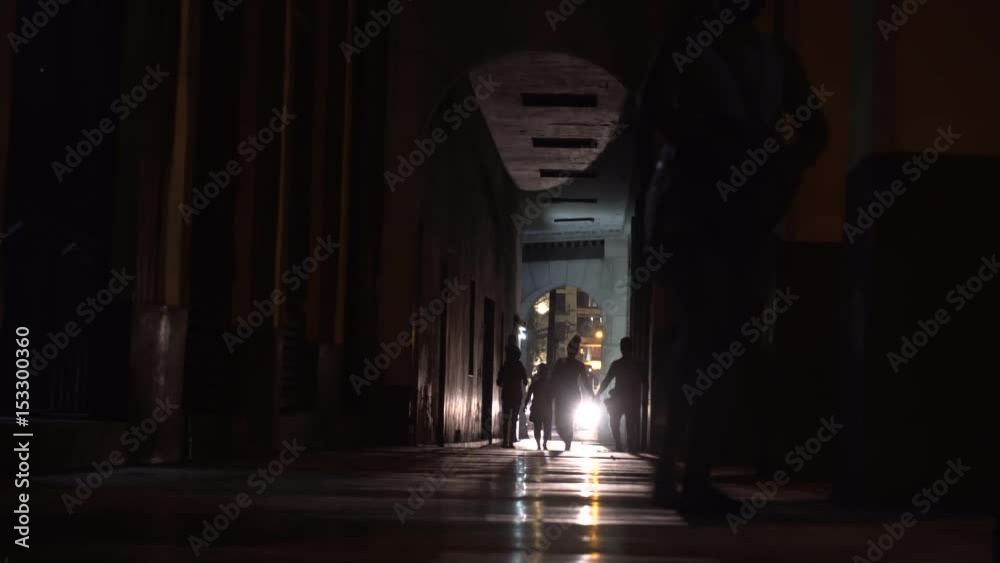 Silhouettes in dark tunnel Silhouettes in dark tunnel