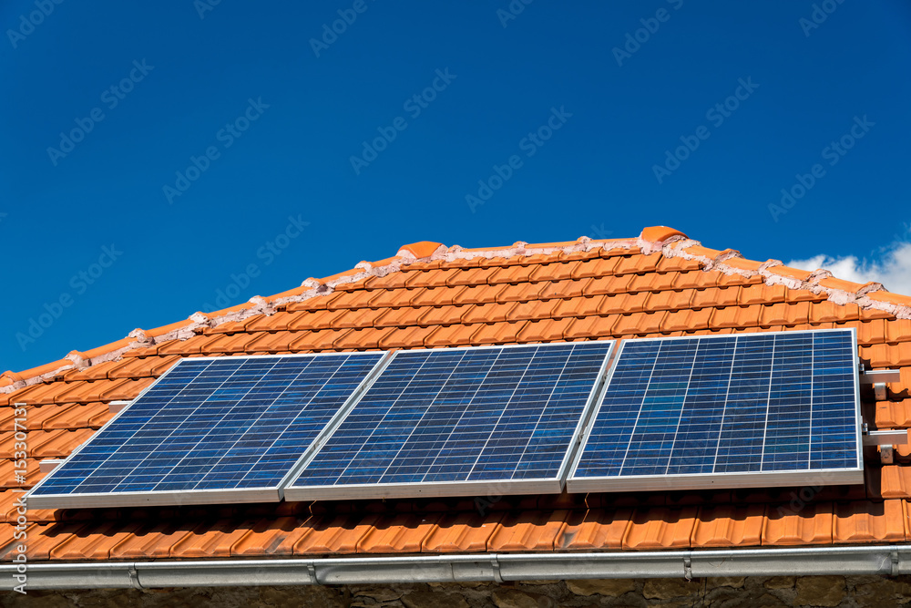 Solar panel on a red roof - alternative electricity source