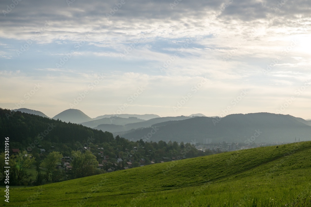 Fototapeta premium Sunrise and sunset over the hills and town. Slovakia