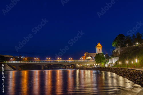 Illuminated medieval fortress and moderm bridge on the river Narva, Estonia and Russia border. Blue hour