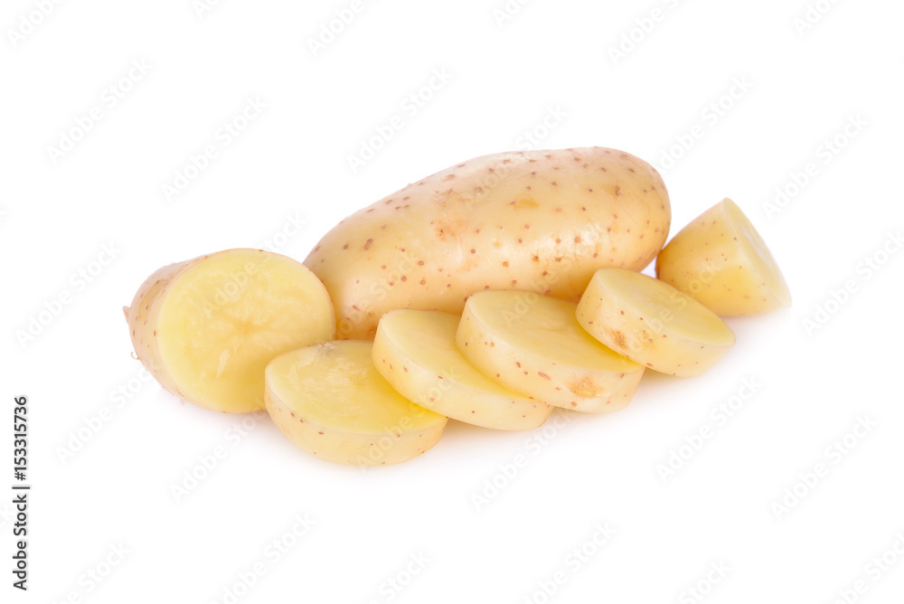whole and sliced raw unpeeled potato on white background