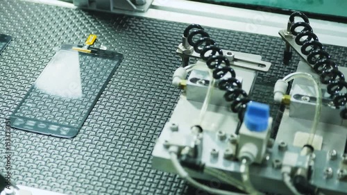 Large Touch Screen Panel of Mobile Phone.
Close up of the production line of large touch screen LCD module transporting one by one.
