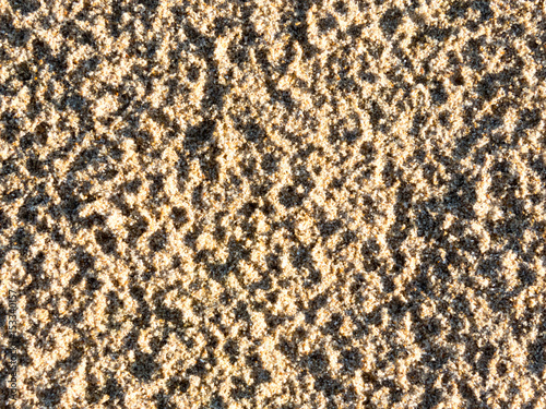 closeup of sand pattern of a beach in the summer