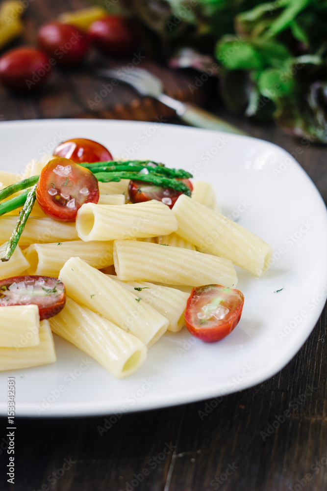 Pasta with asparagus and tomatoes ready to eat Pasta with asparagus and tomatoes ready to eat