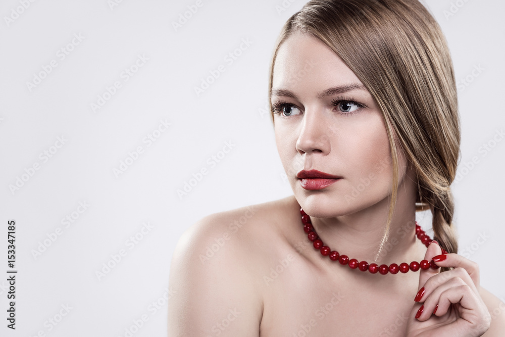 Girl with a red necklace.