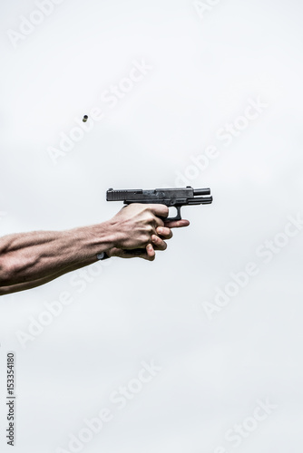 Handgun being fired