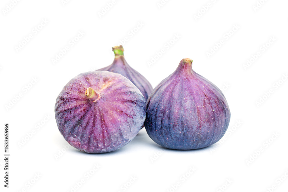 Obraz premium Purple Figs Fruit and Green Leaves. Organic Food on White Background