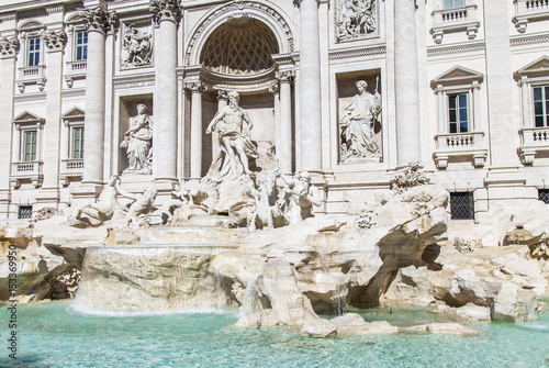 ROME, ITALY, on March 5, 2017. The sun lights Fontana di Trevi (created in 1732-1762 by Nicolo Salvi) adjoining Pauly's palace. The fountain one of city symbols, is imprinted in many movies photo