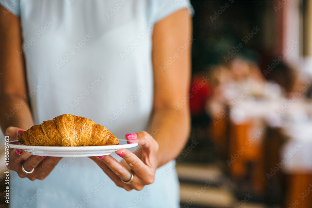 Woman with croissant
