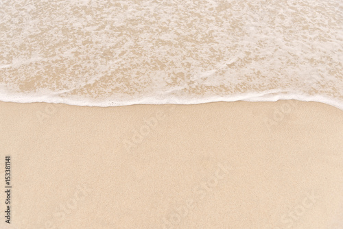 wave on to the beach © AKGK Studio