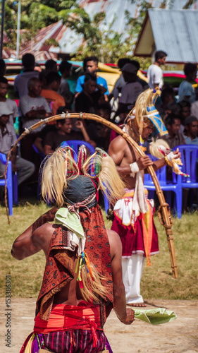 Caci whip dance ceremony in Flores, East Nusa Tenggara photo
