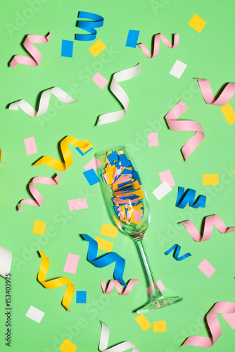 Celebration Flat lay with colorful party items on green background.