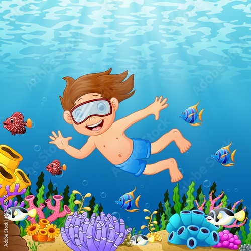 Cartoon boy swimming in the sea with fish