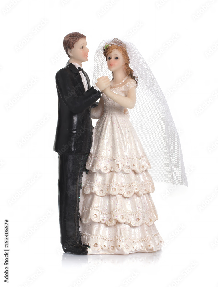 Bride and groom, old cake topper on white background