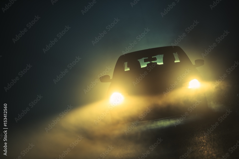 Naklejka premium Car Driving in the Fog