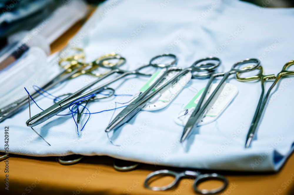 Fototapeta premium Medical threads and needles in the operating room are prepared for use.