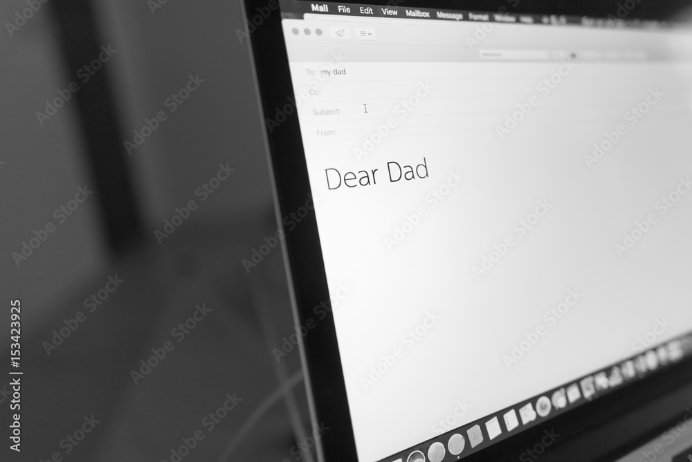 laptop with text an email to Dad in bedroom with dim light, Concept : father day, homesick.
