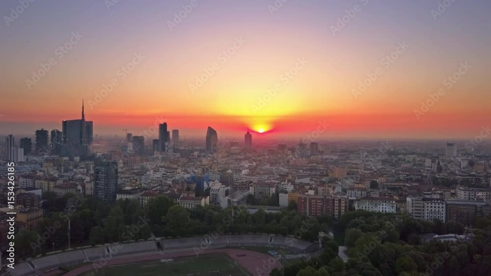 milan city skyline aerial shot at sunrise flying forwards milan city skyline aerial shot at sunrise flying forwards