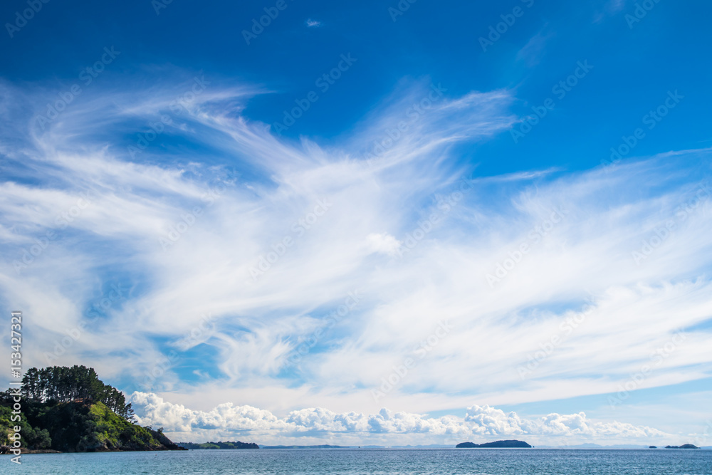 Clouds over Little Palm Beach on Waiheke Island, New Zealand