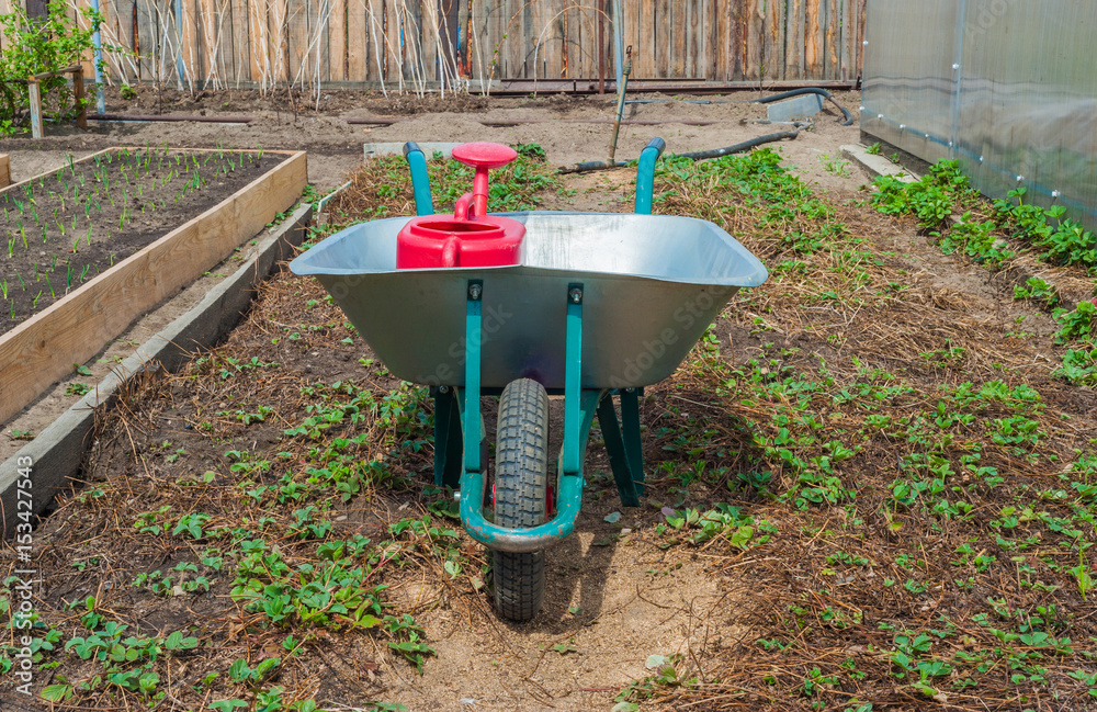 garden cart with a watering can garden cart with a watering can