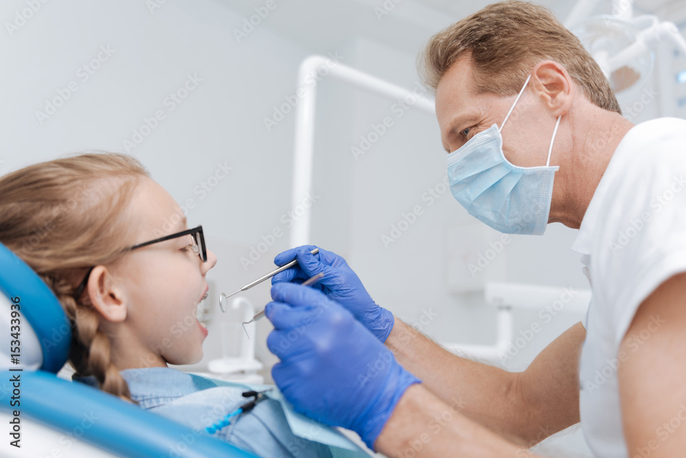 Experienced trained dentist doing his job