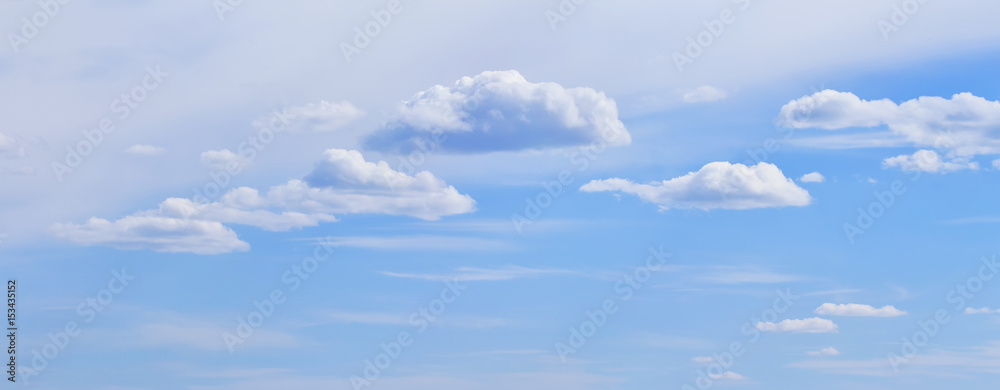 Blue sky with clouds soft pastel panoramic spring weather diagonal background Blue sky with clouds soft pastel panoramic spring weather diagonal background