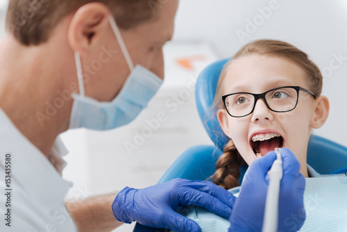 Trained wise dentist employing modern equipment