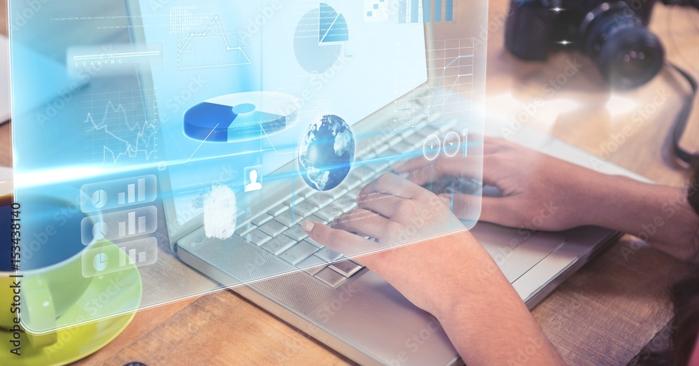 Business person using laptop with overlay Business person using laptop with overlay