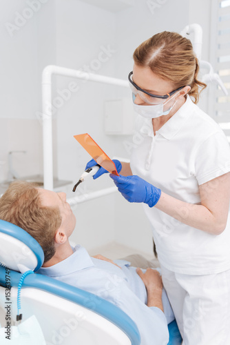 Deducted trained specialist conducting whitening manipulation