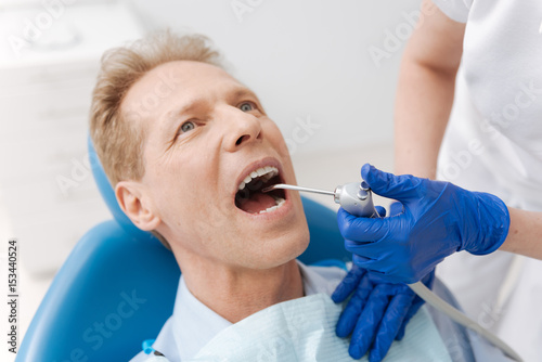 Charming middle aged man keeping his mouth open