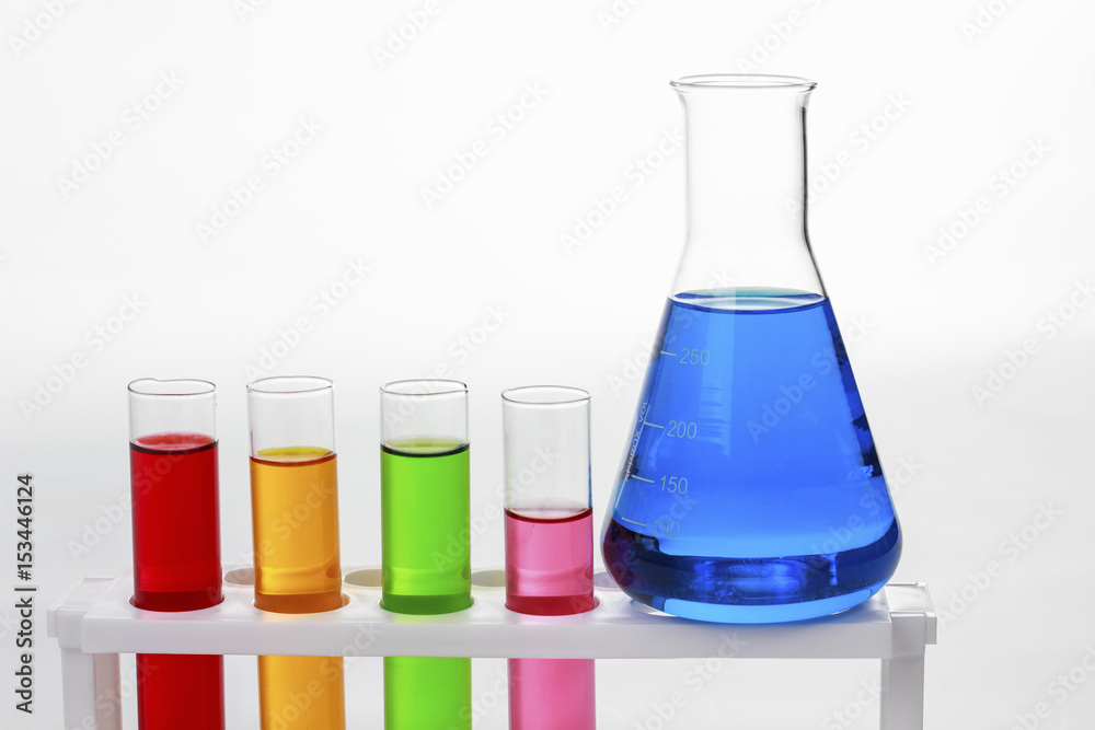 test tubes in a test on white background for symbolic photo for learning and researching. test tubes in a test on white background for symbolic photo for learning and researching.