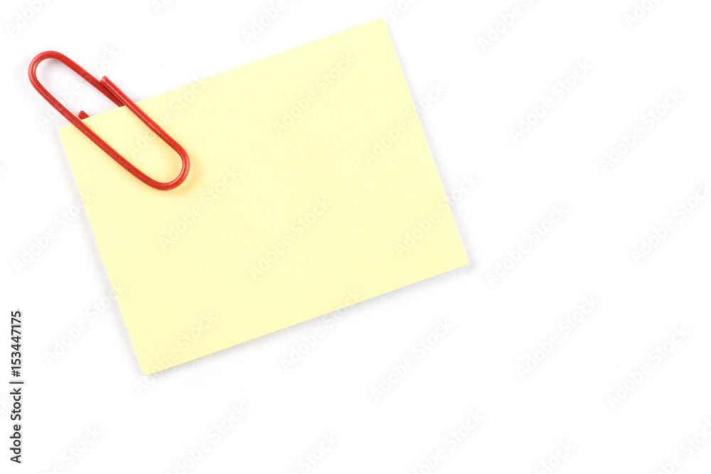 Yellow notepad with bracket on the corner and on the White table.Yellow note papers on White background. Yellow notepad with bracket on the corner and on the White table.Yellow note papers on White background.