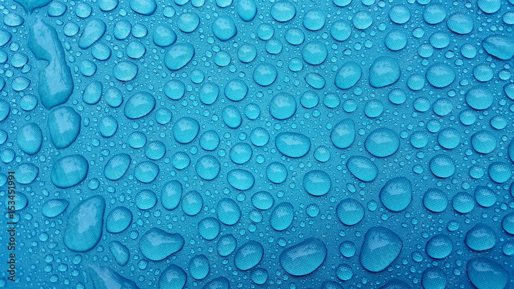 Drop of water on a blue background.