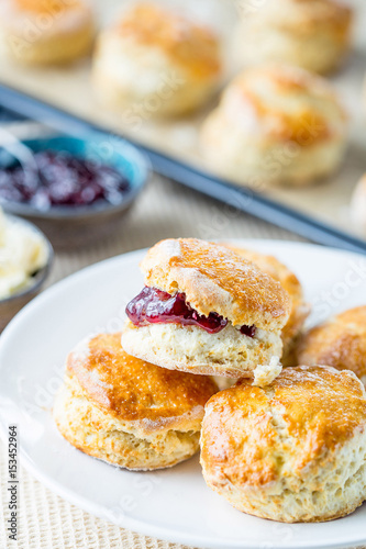 Cream Scones with Strawberry Jam and Clotted Cream, Shallow Depth of Field, Close Up Vertical View