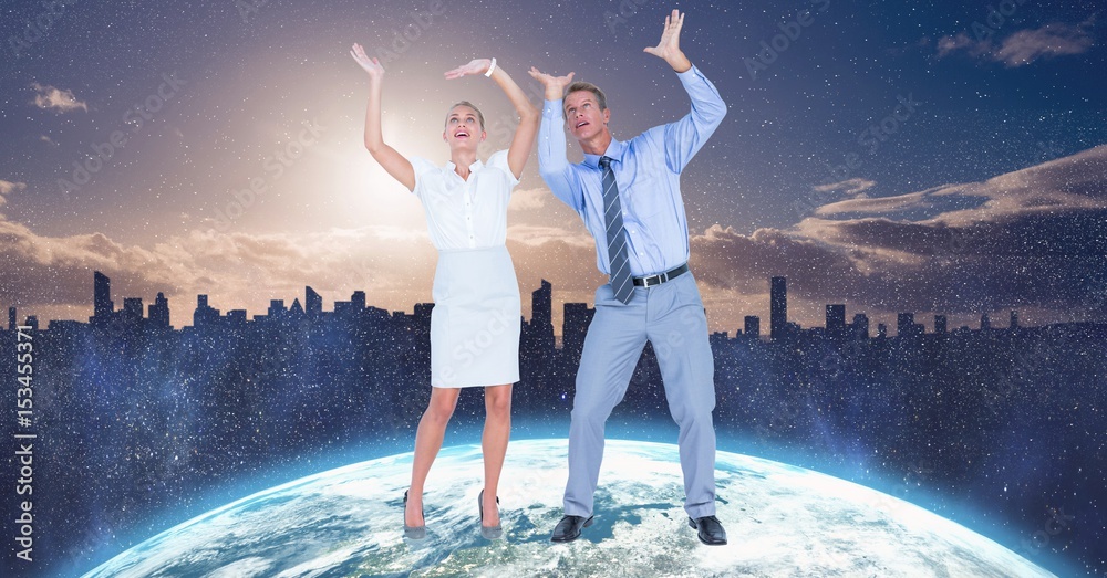 Obraz na plátně Business people with arms raised on globe