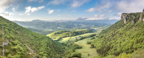 French countryside. View over the mountains (Trois Becs, Plateau des Chaux, Grand Barry et la Servelle) of the Drôme in France.