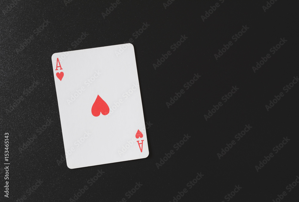 Ace of hearts on a black background, playing cards, copyspace for you marketing text horizontal photo