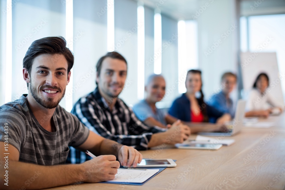 Creative business team sitting in conference room