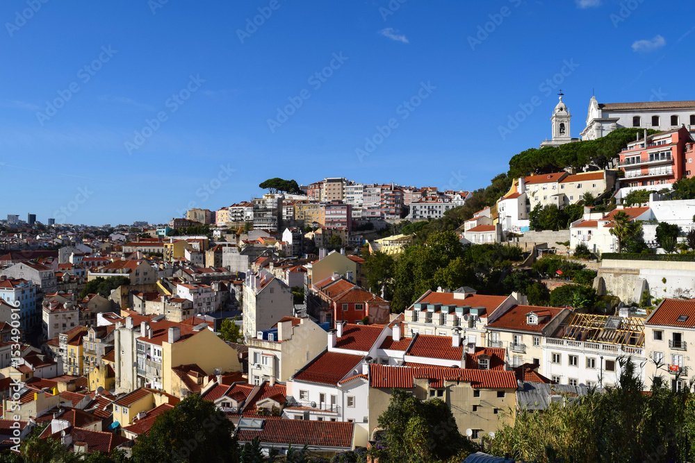 View of the houses beneath the terraces of the Miradouro da Graca panoramic point in Lisbon, Portugal