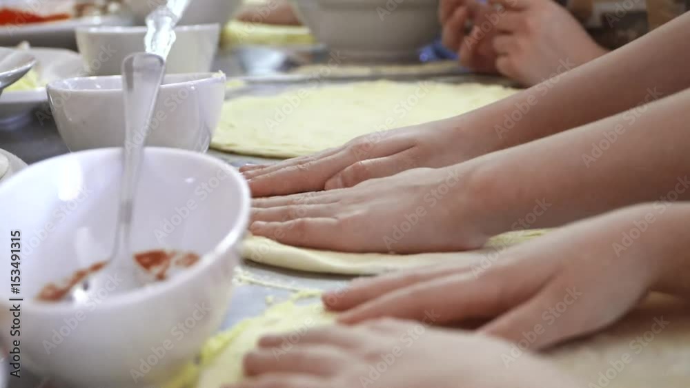 closeup of the hands of children pizza. closeup of the hands of children pizza.