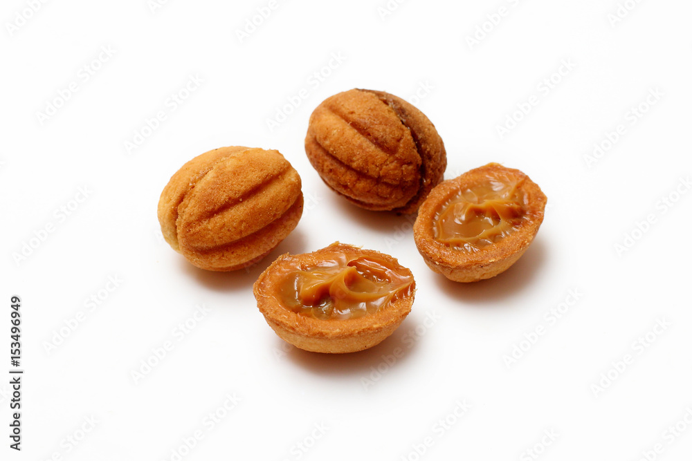 homemade cookies, nuts with condensed milk on white background homemade cookies, nuts with condensed milk on white background