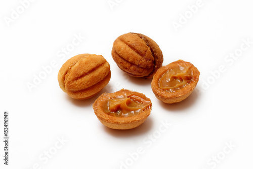 homemade cookies, nuts with condensed milk on white background