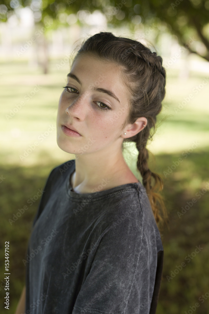 Girl in gray dress in the gardens Girl in gray dress in the gardens