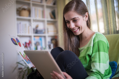 Woman working on digital tablet