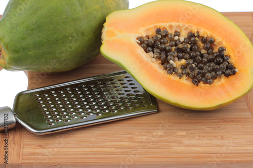 Fresh papaya on the wooden board photo