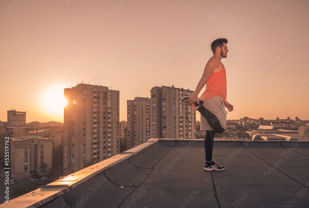 athlete man stretching rooftop roof, Sun sunset sunrise athlete man stretching rooftop roof, Sun sunset sunrise