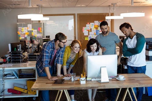 Wallpaper Mural Creative business team working together on desktop pc Torontodigital.ca